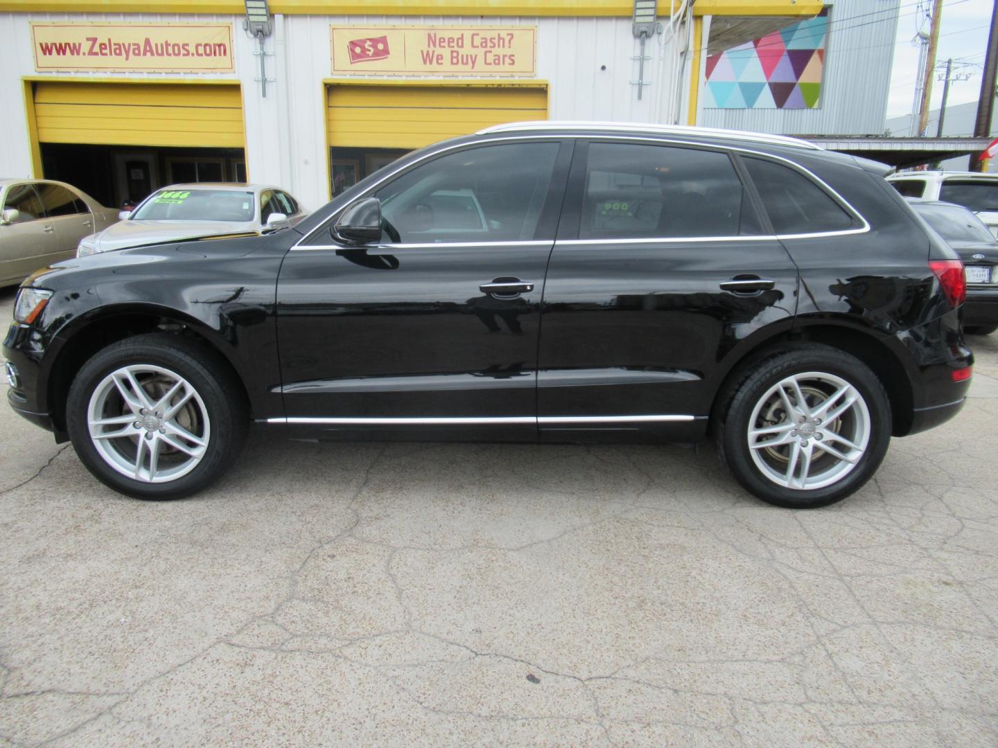 2015 Black /Black Audi Q5 PREMIUM PLUS (WA1LFAFP4FA) with an 2.0L I4 F DOHC 16V engine, Automatic transmission, located at 1511 North Shepherd Dr., Houston, TX, 77008, (281) 657-1221, 29.798361, -95.412560 - 2015 AUDI Q5 2.0T QUATTRO PREMIUM PLUS VIN: WA1LFAFP4FA145528 W A 1 L F A F P 4 F A 1 4 5 5 2 8 4 DOOR WAGON/SPORT UTILITY 2.0L I4 F DOHC 16V FLEX FUEL ALL WHEEL DRIVE - Photo#0